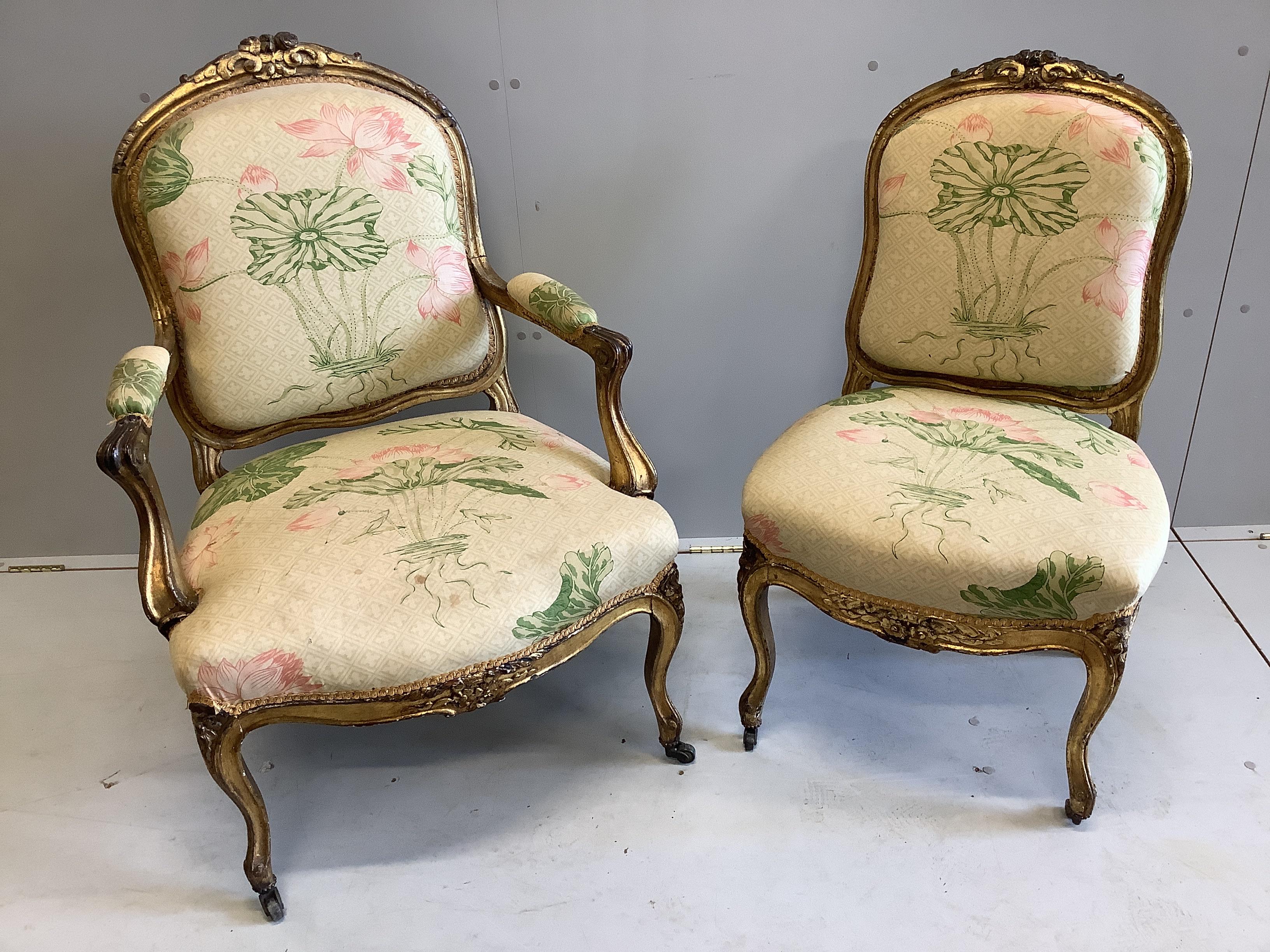 A pair of Louis XVI style gilt fauteuils, one with arms, larger width 65cm, depth 55cm, height 100cm